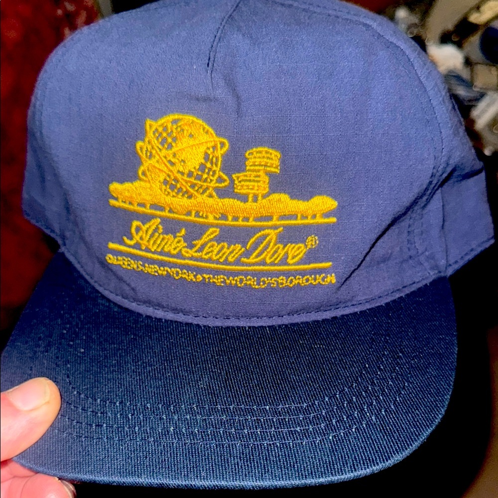 Amie Leon Dore Unisphere navy and gold hat